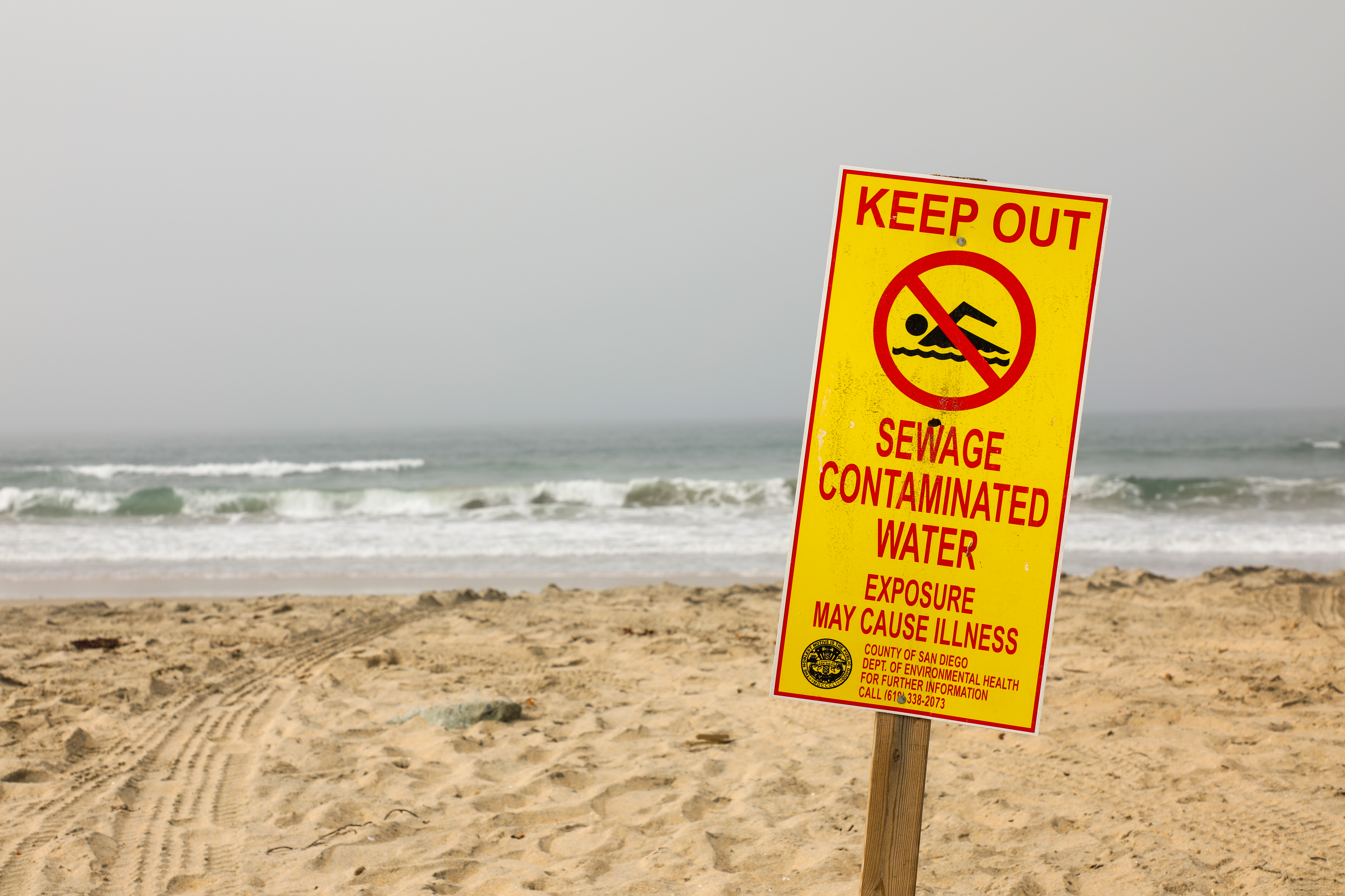 Sewage Contaminated Water sign on beach